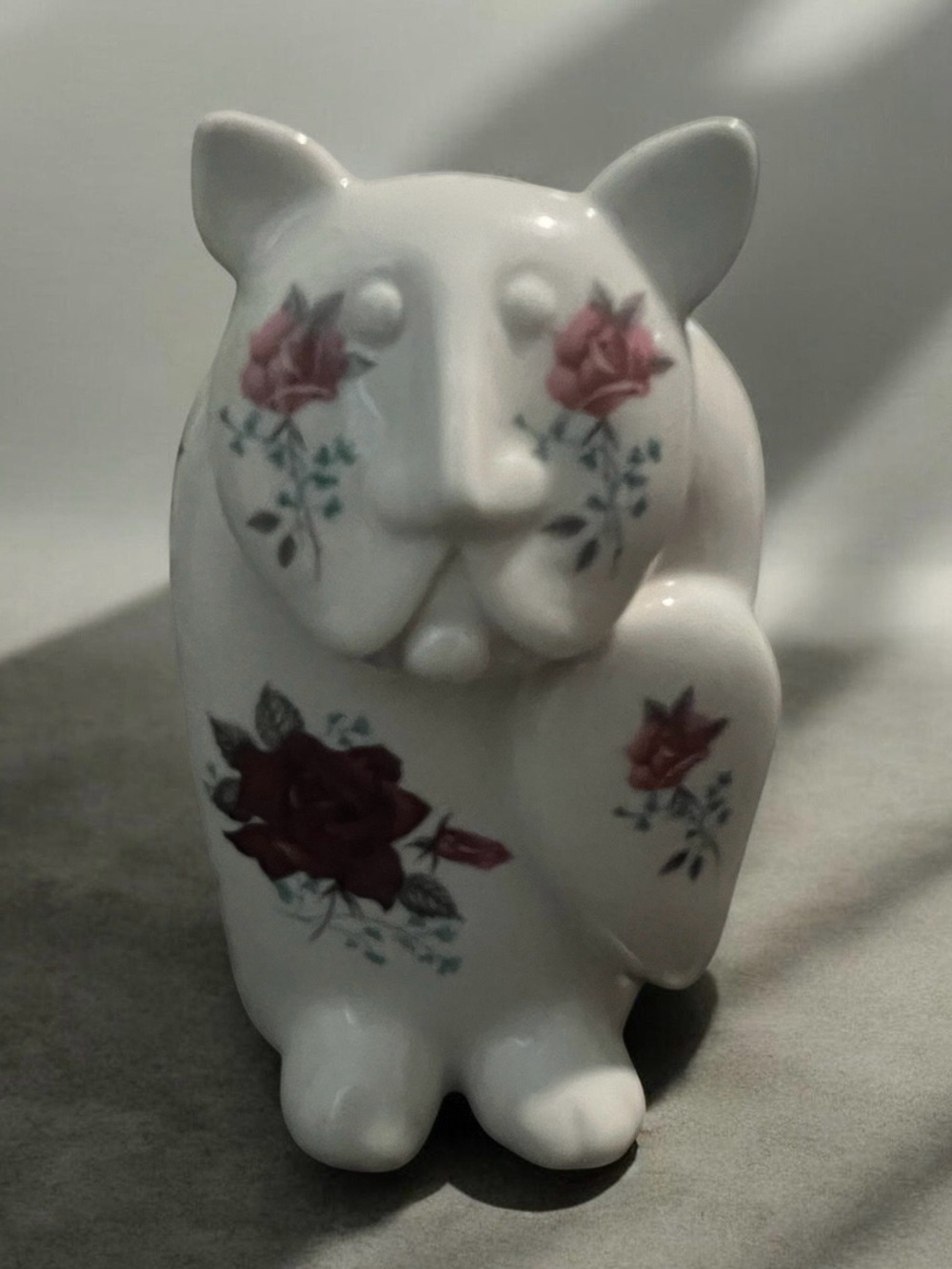 1970s Royal Dux porcelain cat figurine designed by Pravoslav Rada with roses.